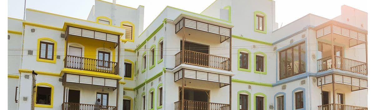 Auroma Phase II — a row of homes with yellow, green and blue balcony trims.